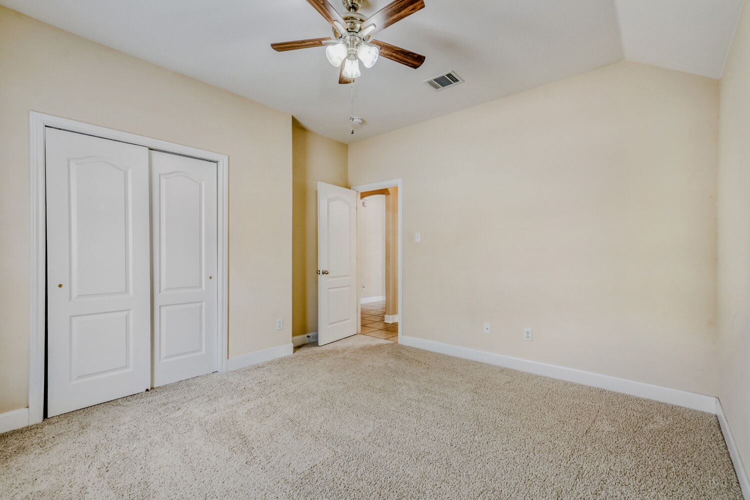 24 Stone Terrace Drive Austin, TX 78734 - Photo 15 of 32 an empty room with closet and a chandelier fan
