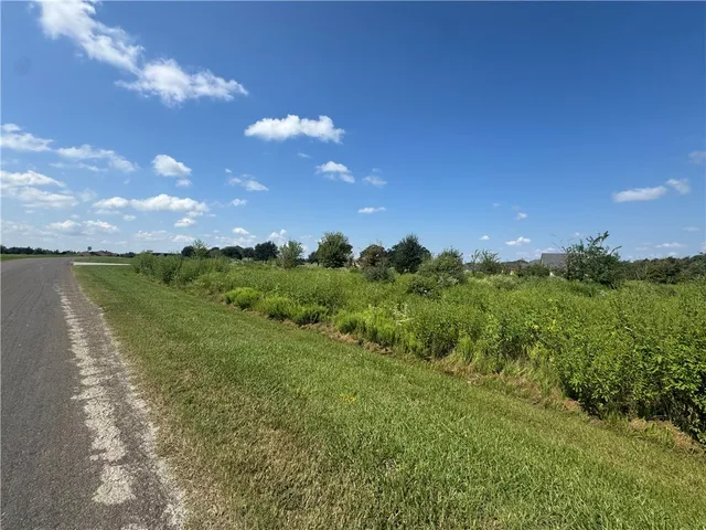 a view of a lake with houses in the back