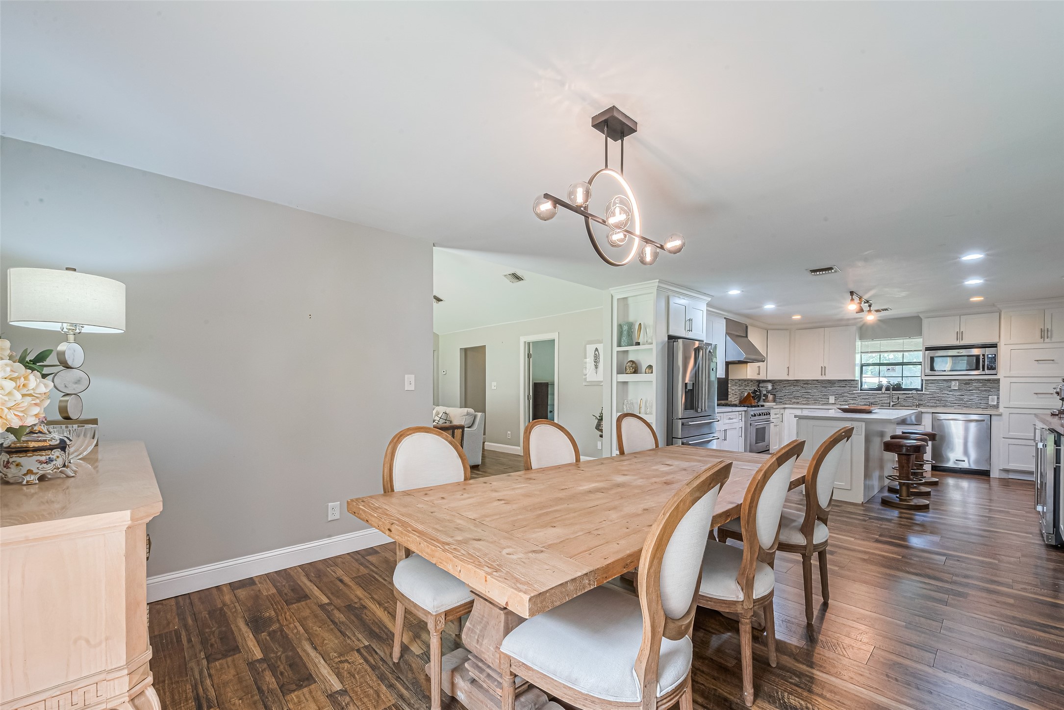 24314 Anderson Street Huffman, TX 77336 - Photo 16 of 48 a view of a dining room with furniture and wooden floor