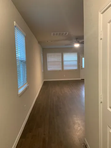 a view of room with window and hardwood floor