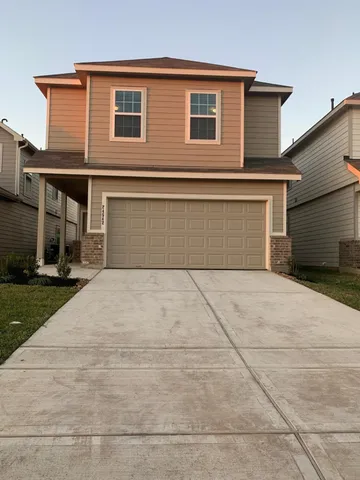 a house view with a backyard