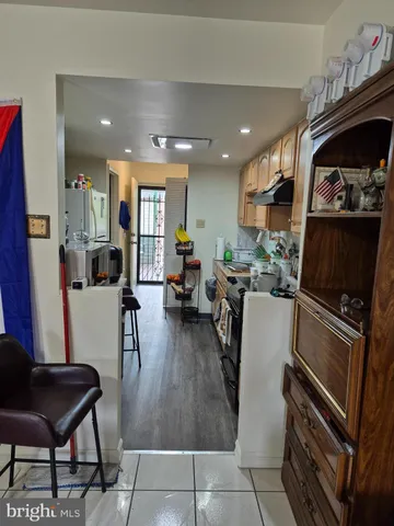 a bathroom with a toilet and a shower curtain