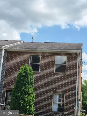 a view of walk in closet with wooden floor