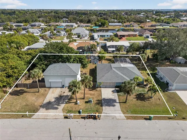 an aerial view of a house with a garden