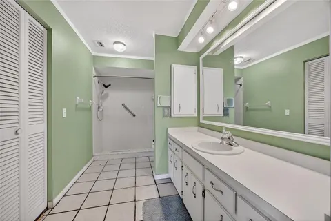 a bathroom with a double vanity sink and a mirror