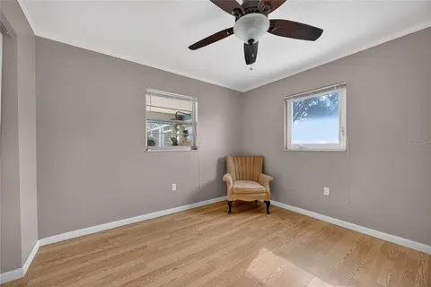 a view of room with window and ceiling fan