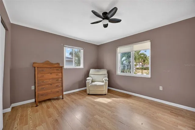 a hallway with couch and a window