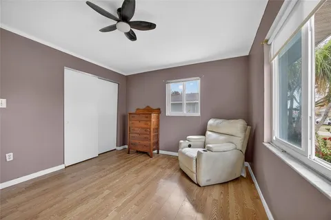 a living room with furniture and a window