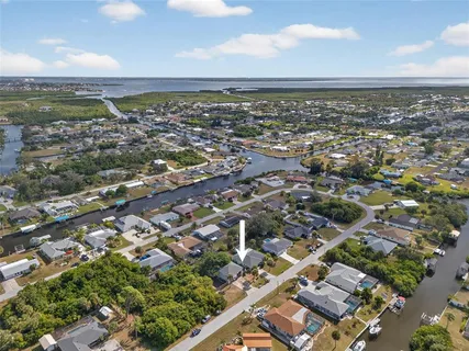 an aerial view of residential building and ocean