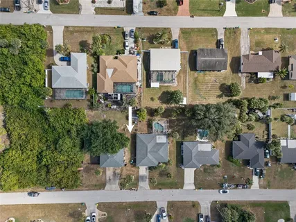 an aerial view of houses with outdoor space