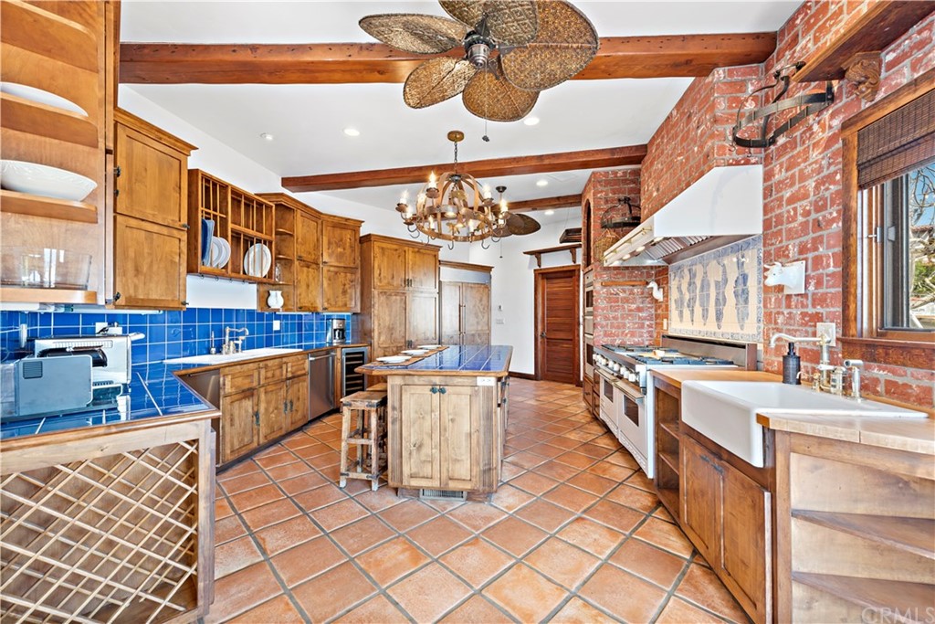 111 Emerald Bay Laguna Beach, CA 92651 - Photo 11 of 60 a view of a dining room with furniture and chandelier
