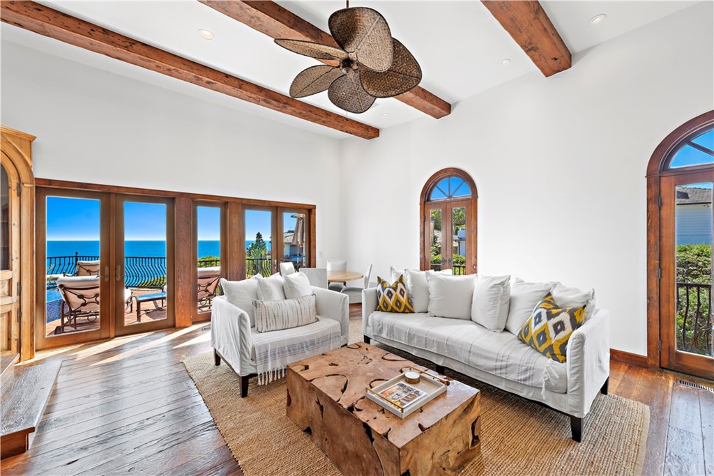 111 Emerald Bay Laguna Beach, CA 92651 - Photo 19 of 60 a living room with furniture or couch and a large window