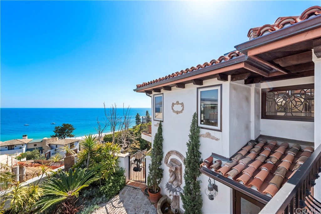 111 Emerald Bay Laguna Beach, CA 92651 - Photo 43 of 60 a view of a house with roof and wooden fence
