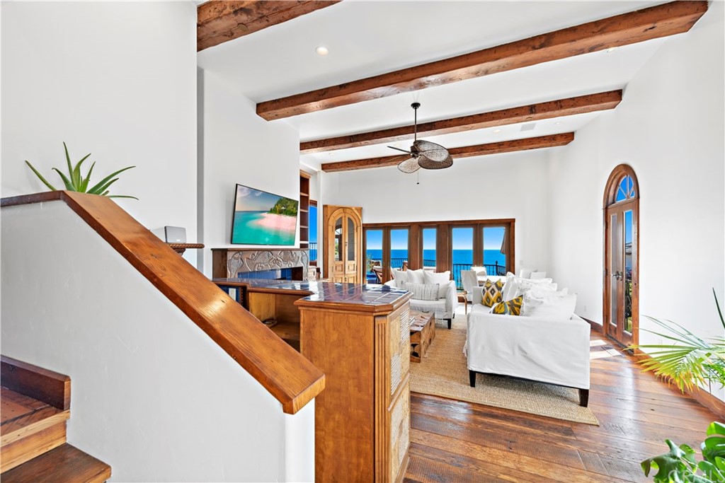 111 Emerald Bay Laguna Beach, CA 92651 - Photo 9 of 60 a living room with furniture and a flat screen tv