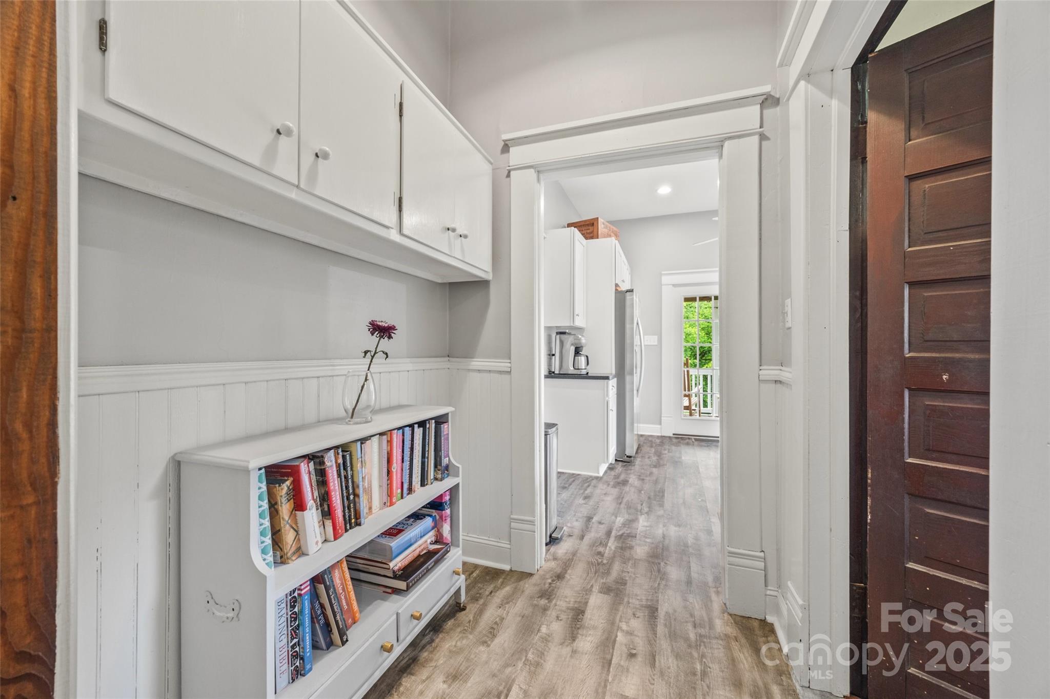 4569 Edgeland Road Edgemoor, SC 29712 - Photo 15 of 44 a view of a hallway with wooden floor and cabinet