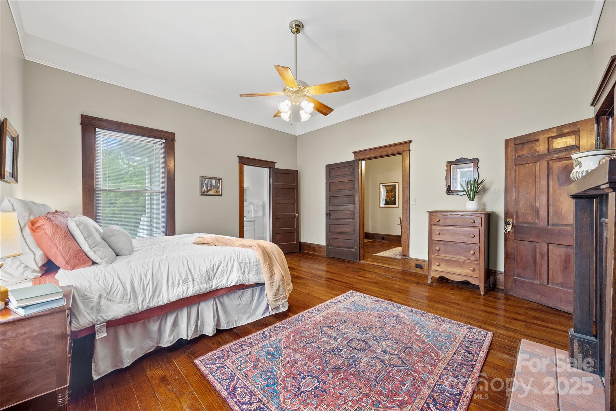 4569 Edgeland Road Edgemoor, SC 29712 - Photo 18 of 44 a bedroom with a bed and wooden floor