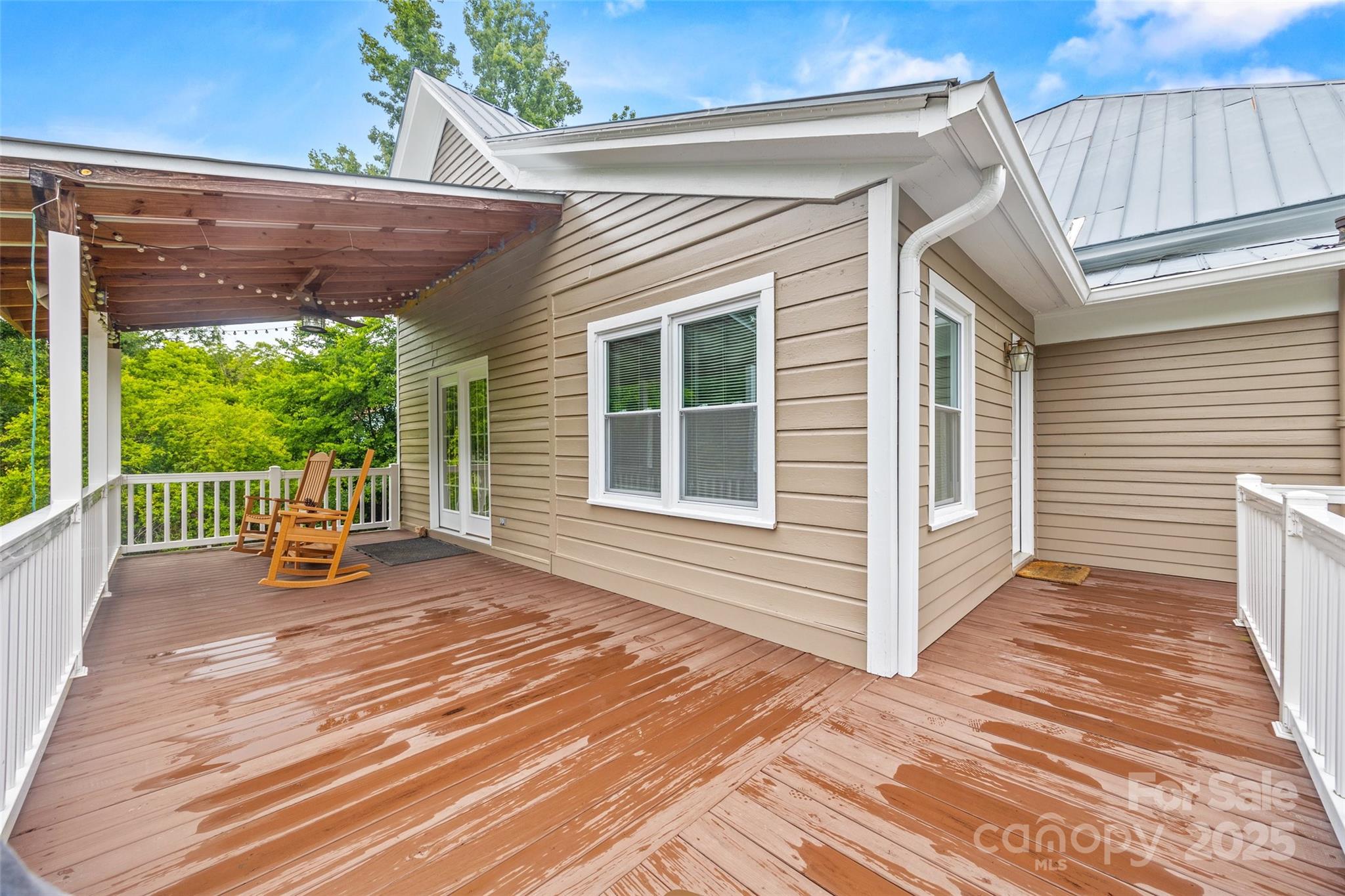 4569 Edgeland Road Edgemoor, SC 29712 - Photo 32 of 44 a view of a deck with wooden floor and roof with a garden view