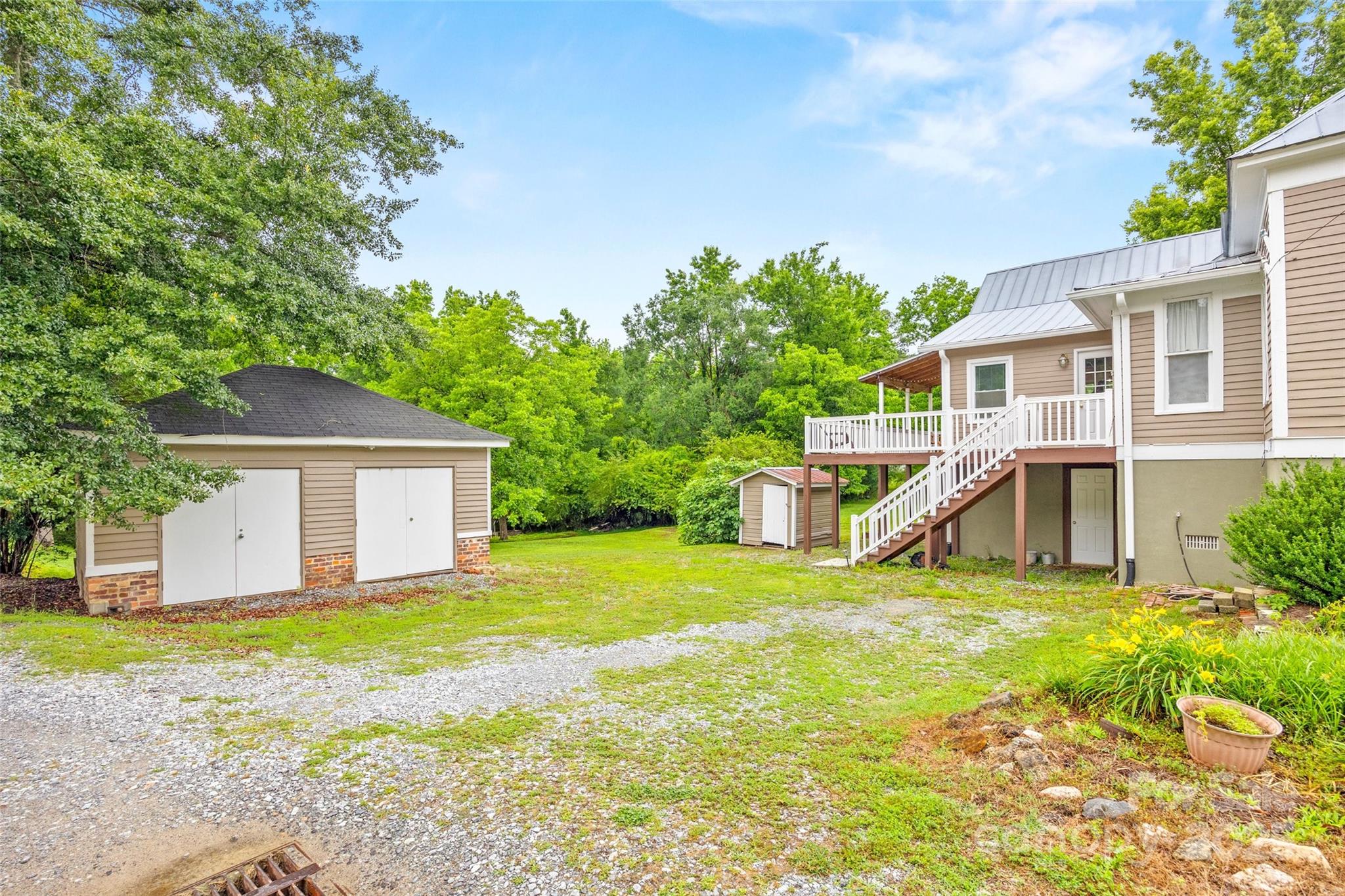 4569 Edgeland Road Edgemoor, SC 29712 - Photo 34 of 44 a view of a house with a yard and sitting area