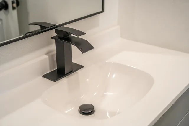 a bathroom with a sink and a mirror