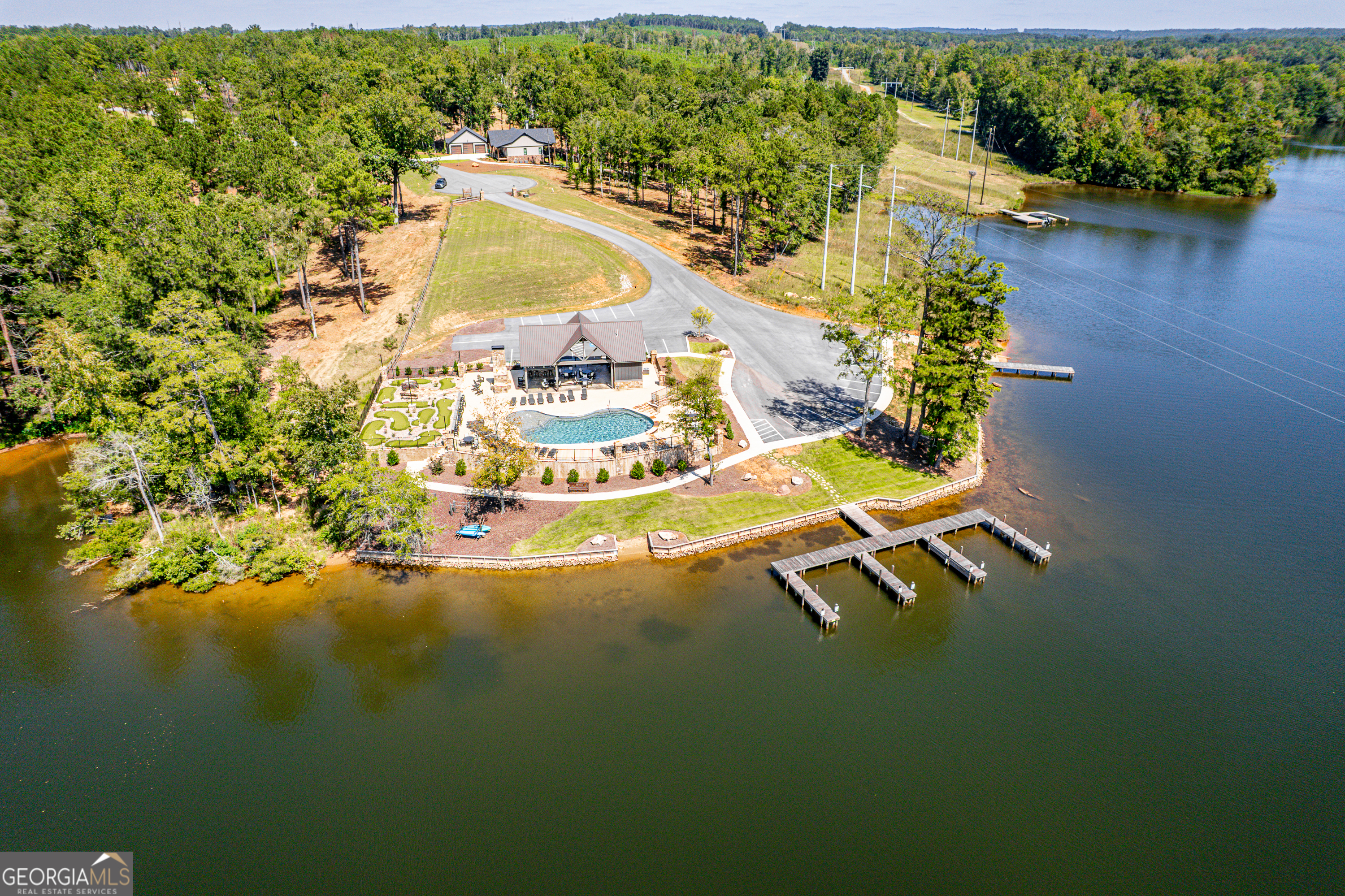 302 Wind Rock Ridge Northeast Milledgeville, GA 31061 - Photo 1 of 24 a view of a swimming pool with outdoor seating and yard