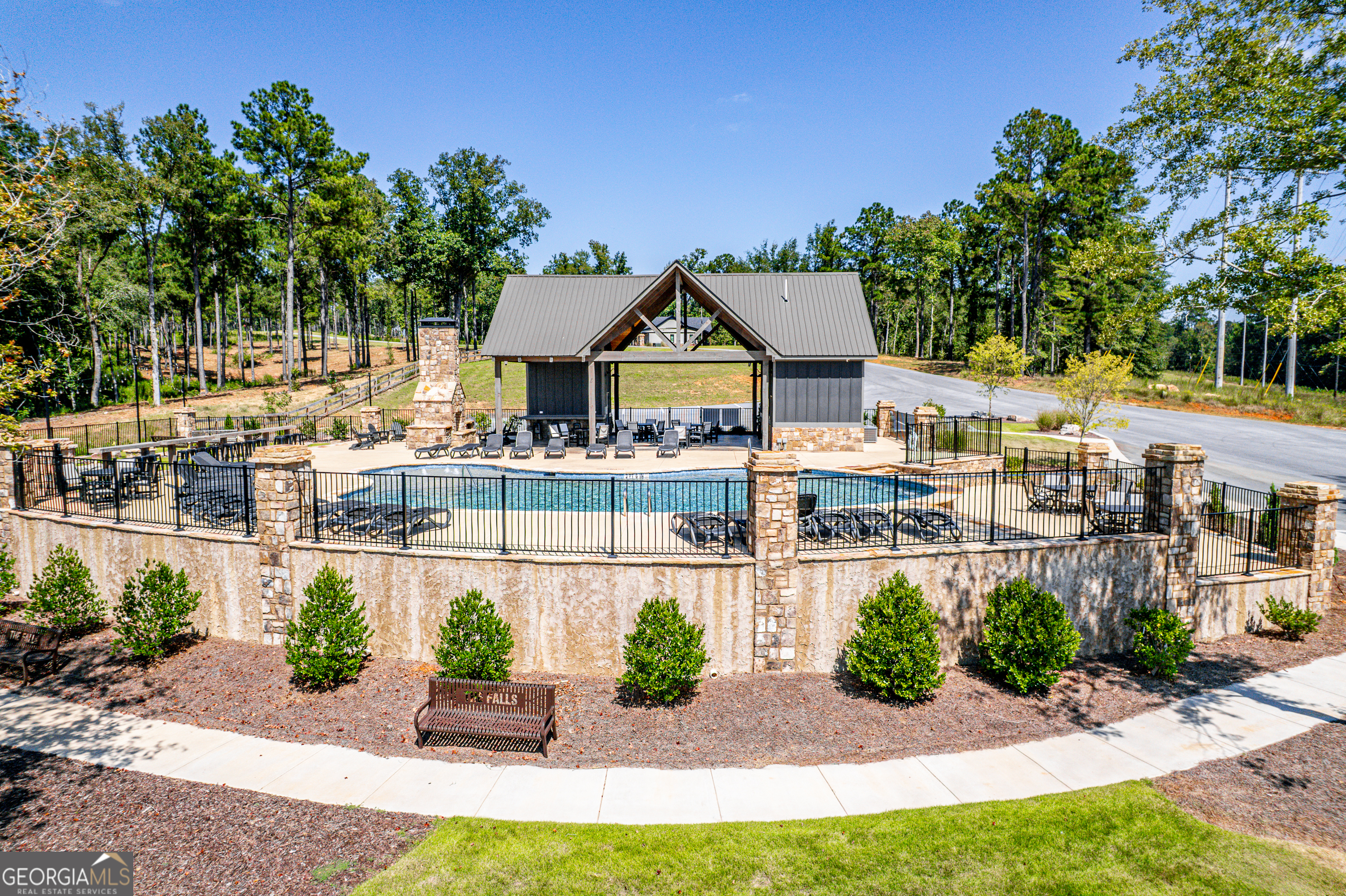 302 Wind Rock Ridge Northeast Milledgeville, GA 31061 - Photo 14 of 24 a front view of a house with a garden and plants