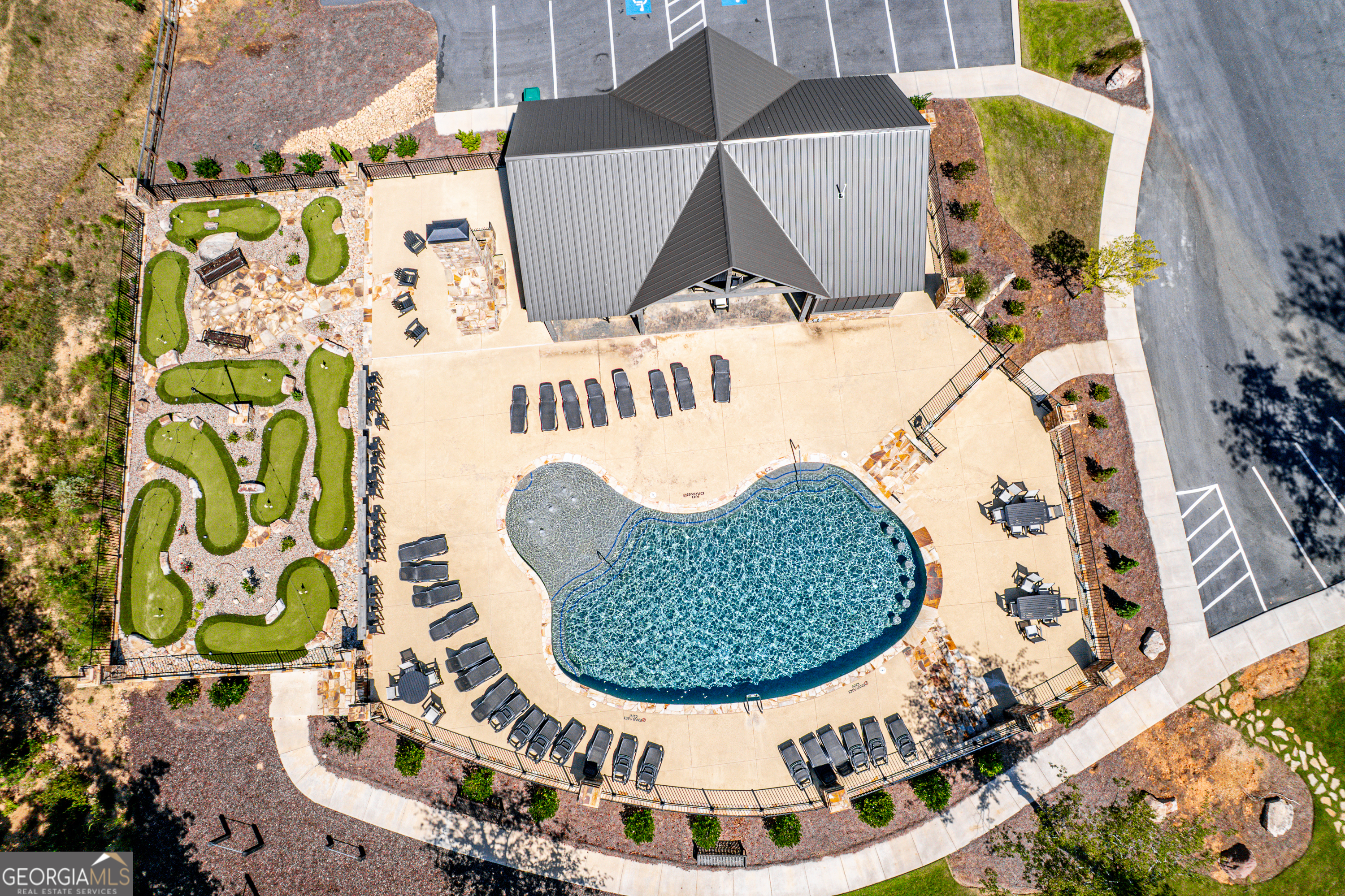 302 Wind Rock Ridge Northeast Milledgeville, GA 31061 - Photo 17 of 24 an aerial view of a house with a swimming pool