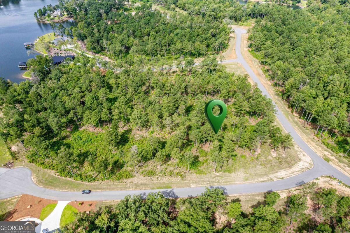 302 Wind Rock Ridge Northeast Milledgeville, GA 31061 - Photo 2 of 24 a view of a garden with a fountain
