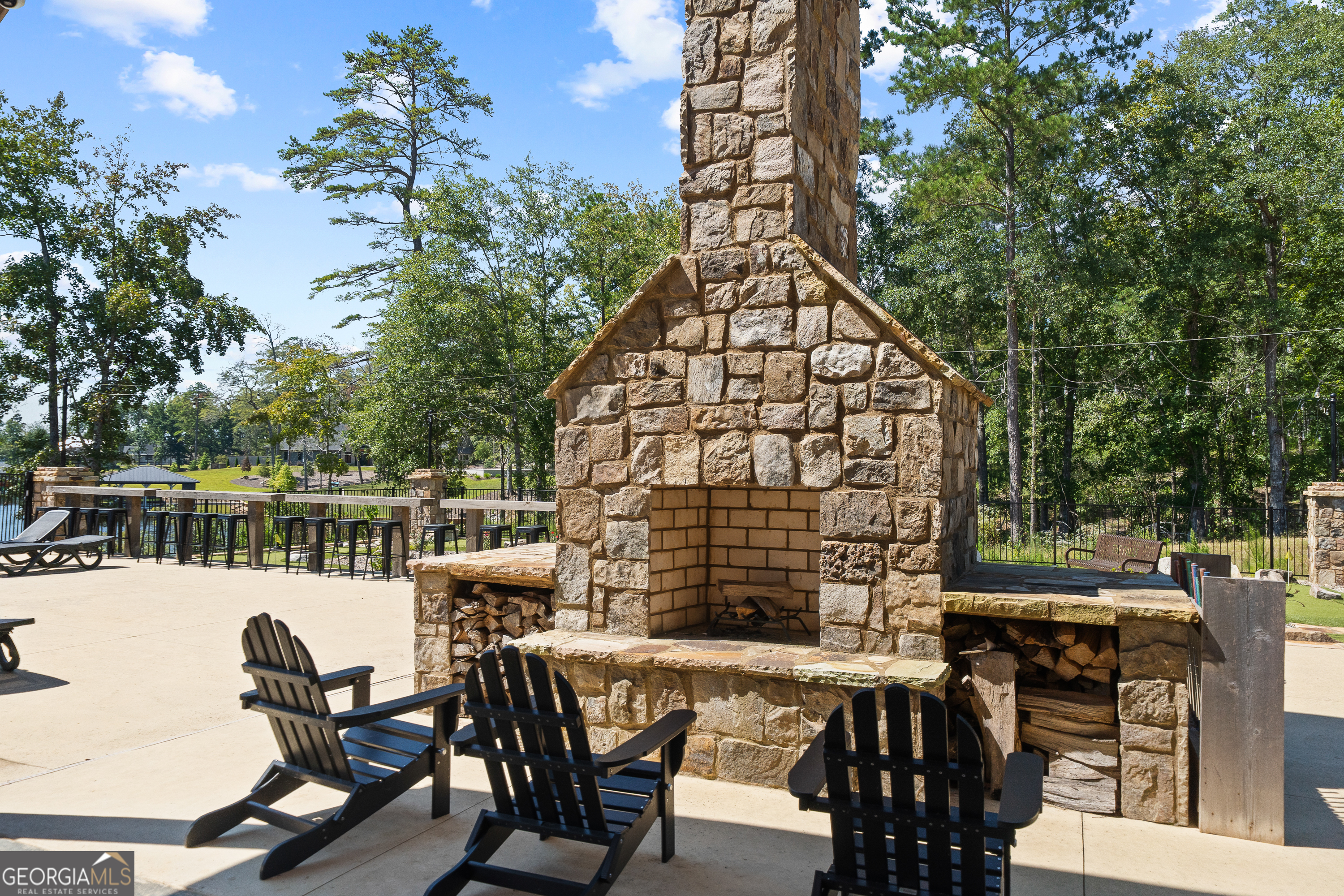302 Wind Rock Ridge Northeast Milledgeville, GA 31061 - Photo 21 of 24 a view of a chairs and table in the patio