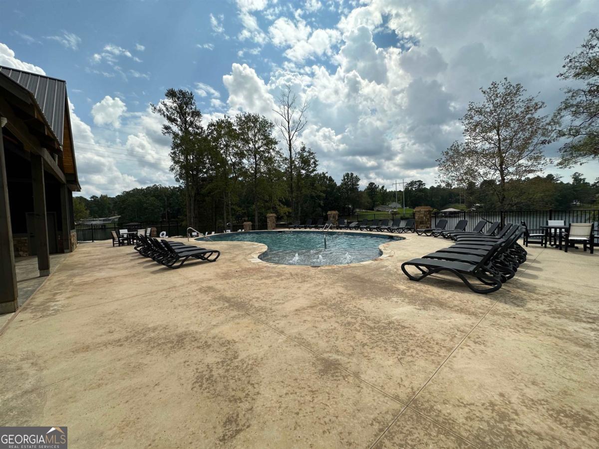 302 Wind Rock Ridge Northeast Milledgeville, GA 31061 - Photo 6 of 11 a view of outdoor space with swimming pool and furniture