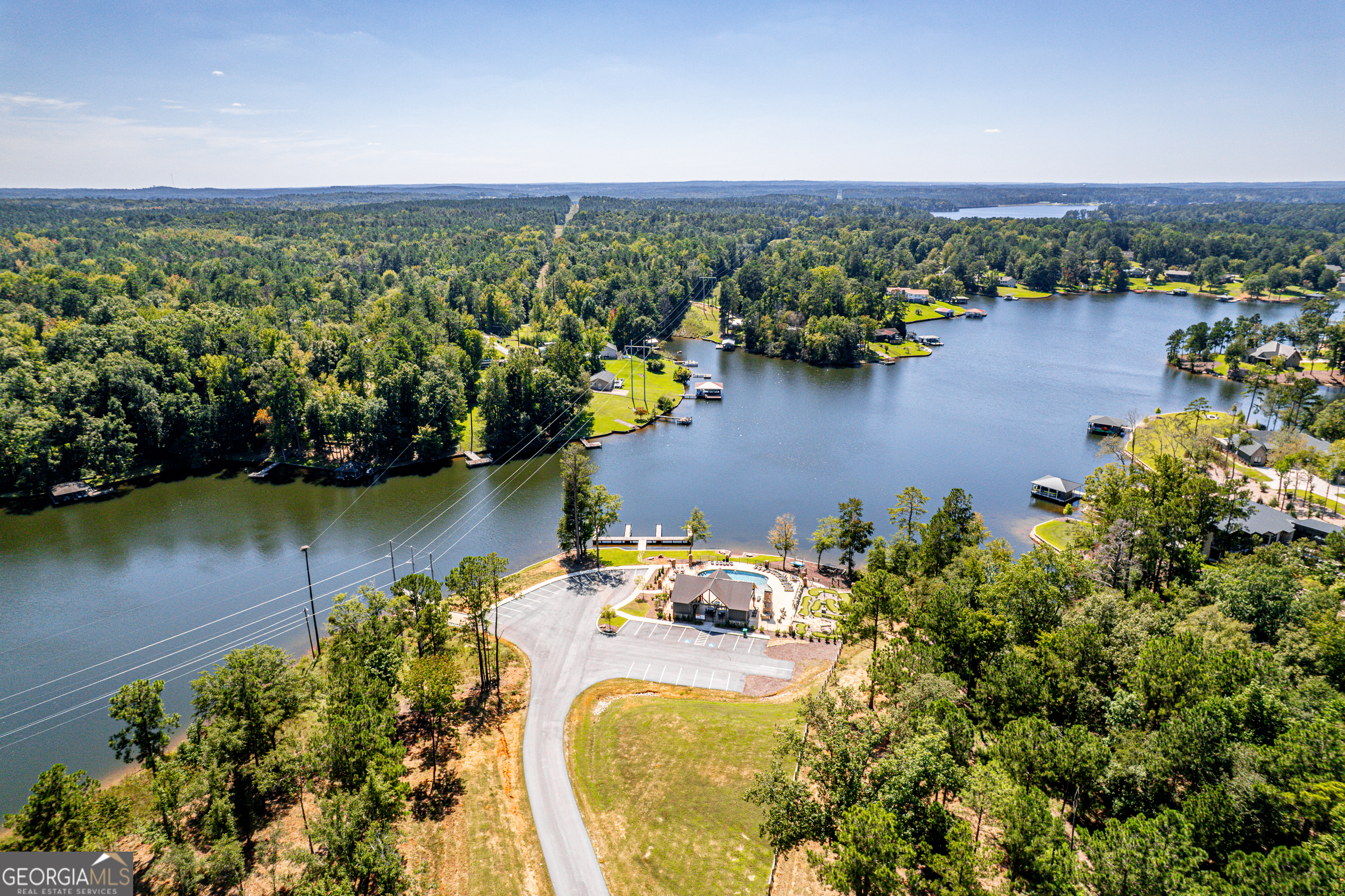 302 Wind Rock Ridge Northeast Milledgeville, GA 31061 - Photo 9 of 24 an aerial view of a house with a lake view