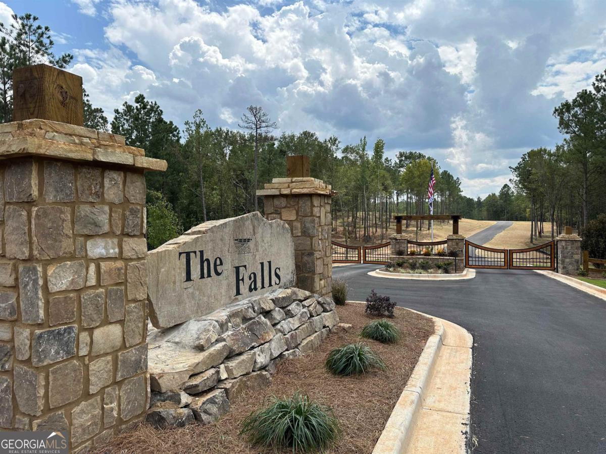 302 Wind Rock Ridge Northeast Milledgeville, GA 31061 - Photo 10 of 11 a view of a patio with couches table and chairs and potted plants