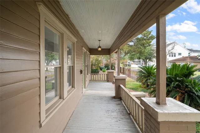 a house with wooden floor in front of it