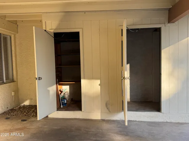 swimming pool view with a seating space