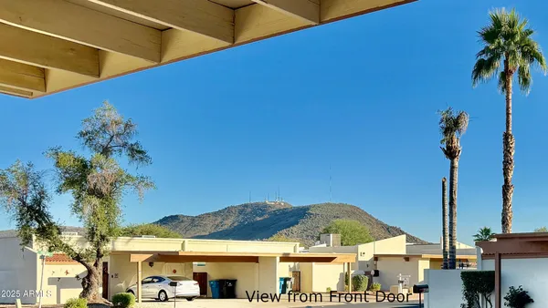 a view of a entryway door and outdoor seating