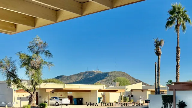 a view of a entryway door and outdoor seating