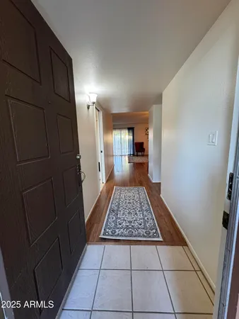 a kitchen with stainless steel appliances granite countertop a stove a refrigerator and a microwave