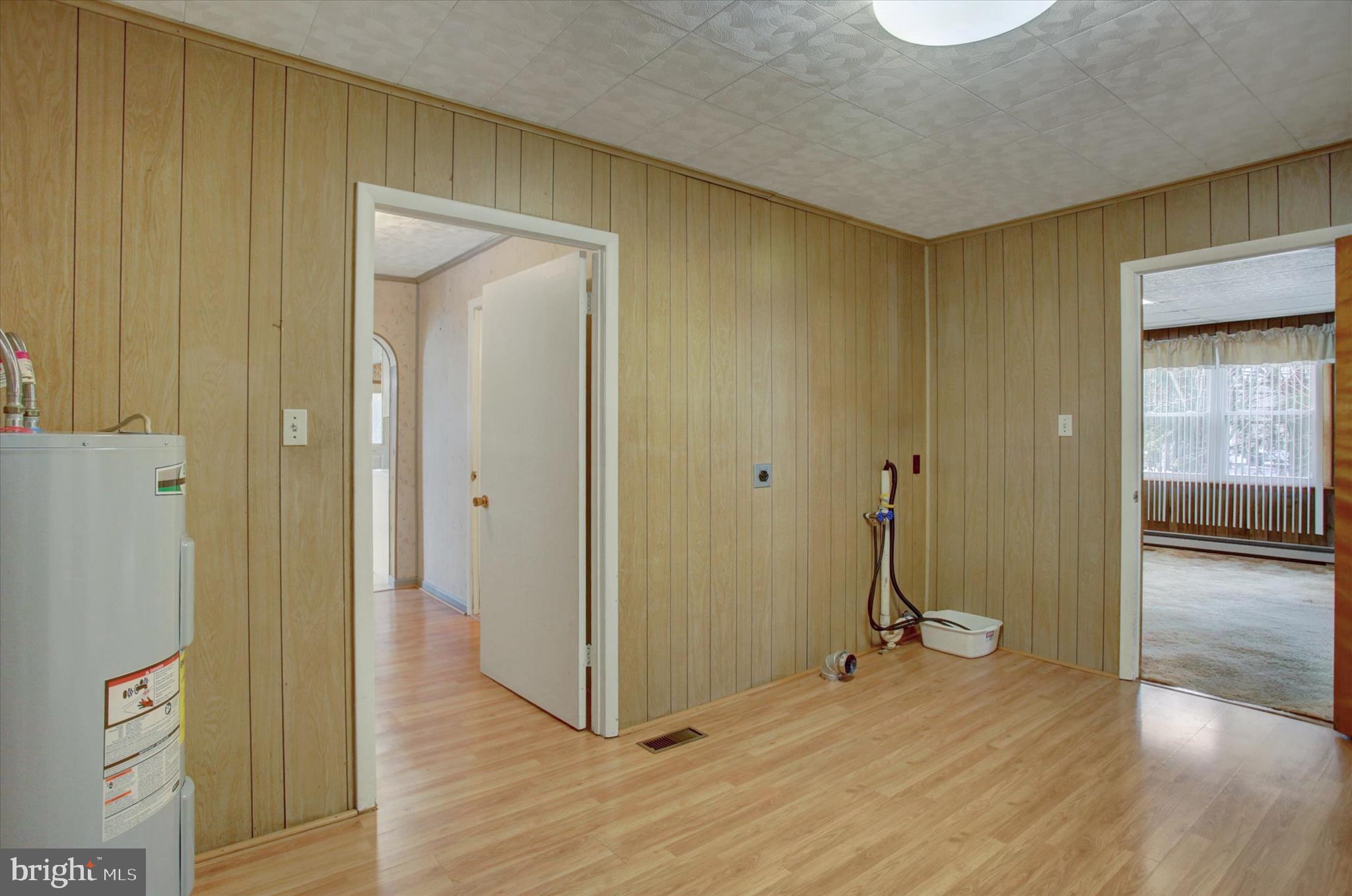 13515 Waterloo Road Waynesboro, PA 17268 - Photo 19 of 42 a view of a hallway with wooden floor and a bathroom