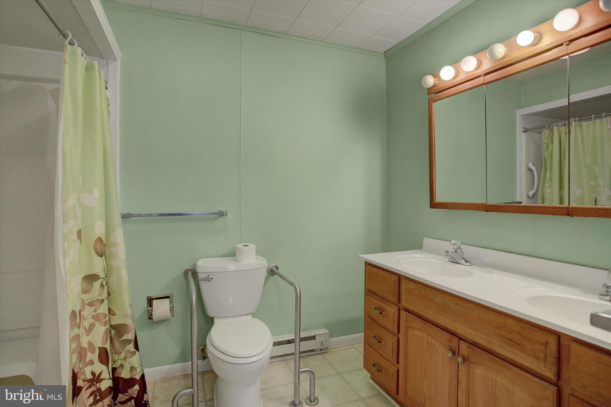 13515 Waterloo Road Waynesboro, PA 17268 - Photo 21 of 42 a bathroom with a toilet sink and mirror