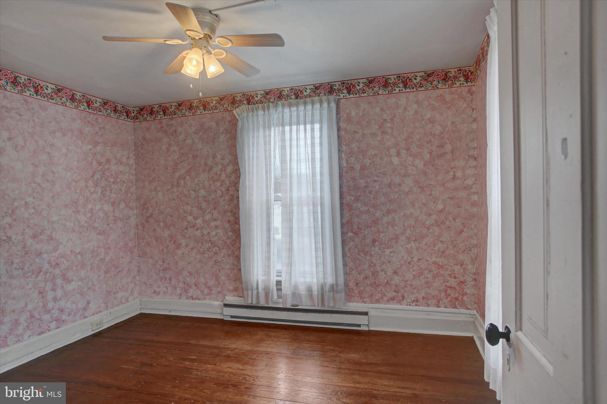 13515 Waterloo Road Waynesboro, PA 17268 - Photo 25 of 42 a view of empty room with wooden floor and fan