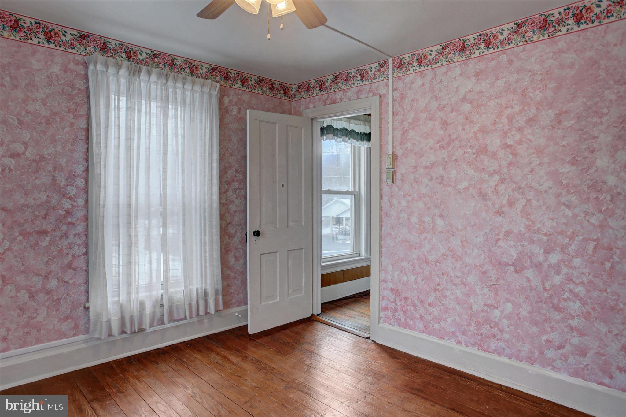 13515 Waterloo Road Waynesboro, PA 17268 - Photo 26 of 42 a view of an empty room with wooden floor and a window
