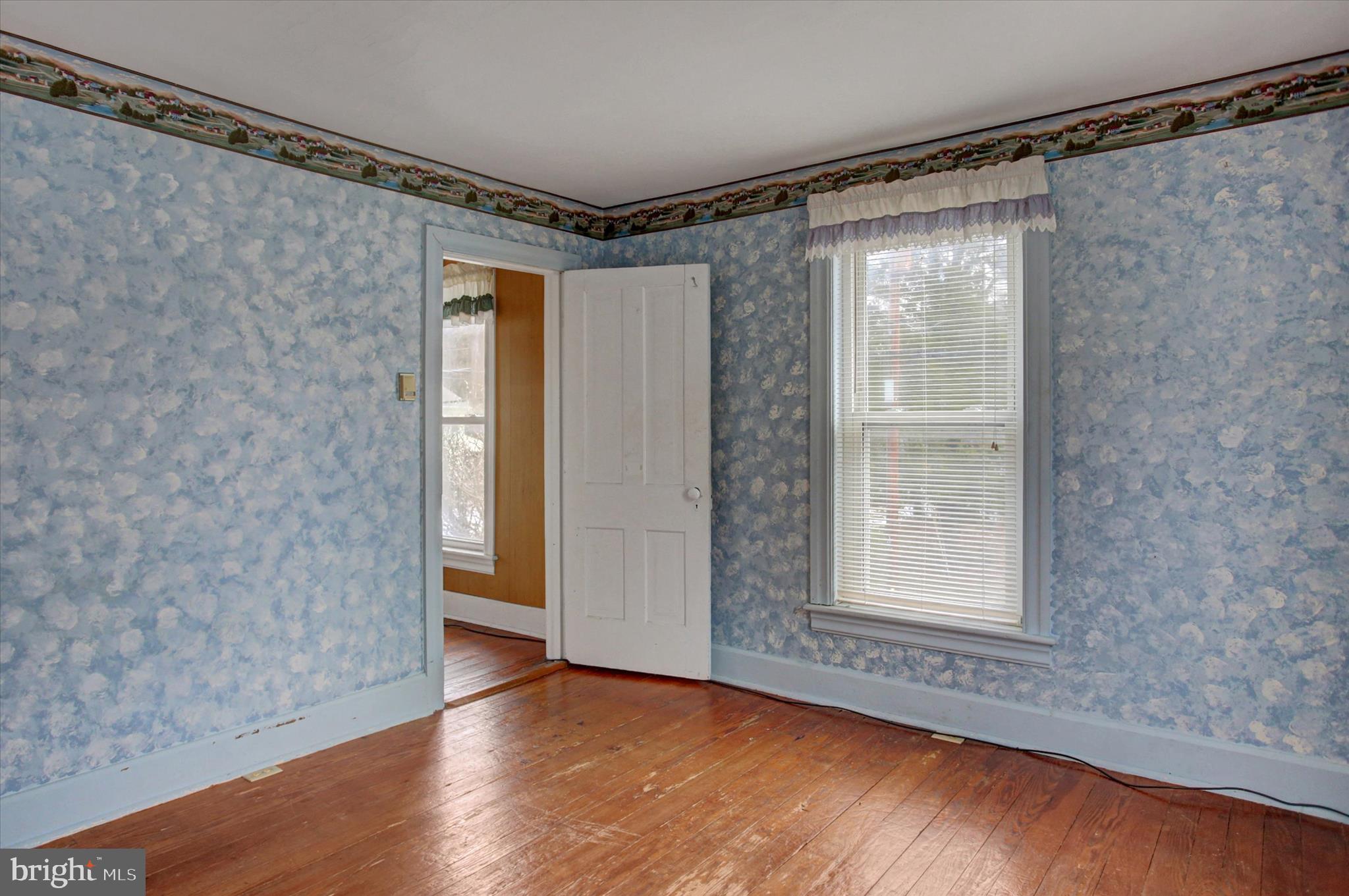 13515 Waterloo Road Waynesboro, PA 17268 - Photo 28 of 42 a view of an empty room with wooden floor and a window