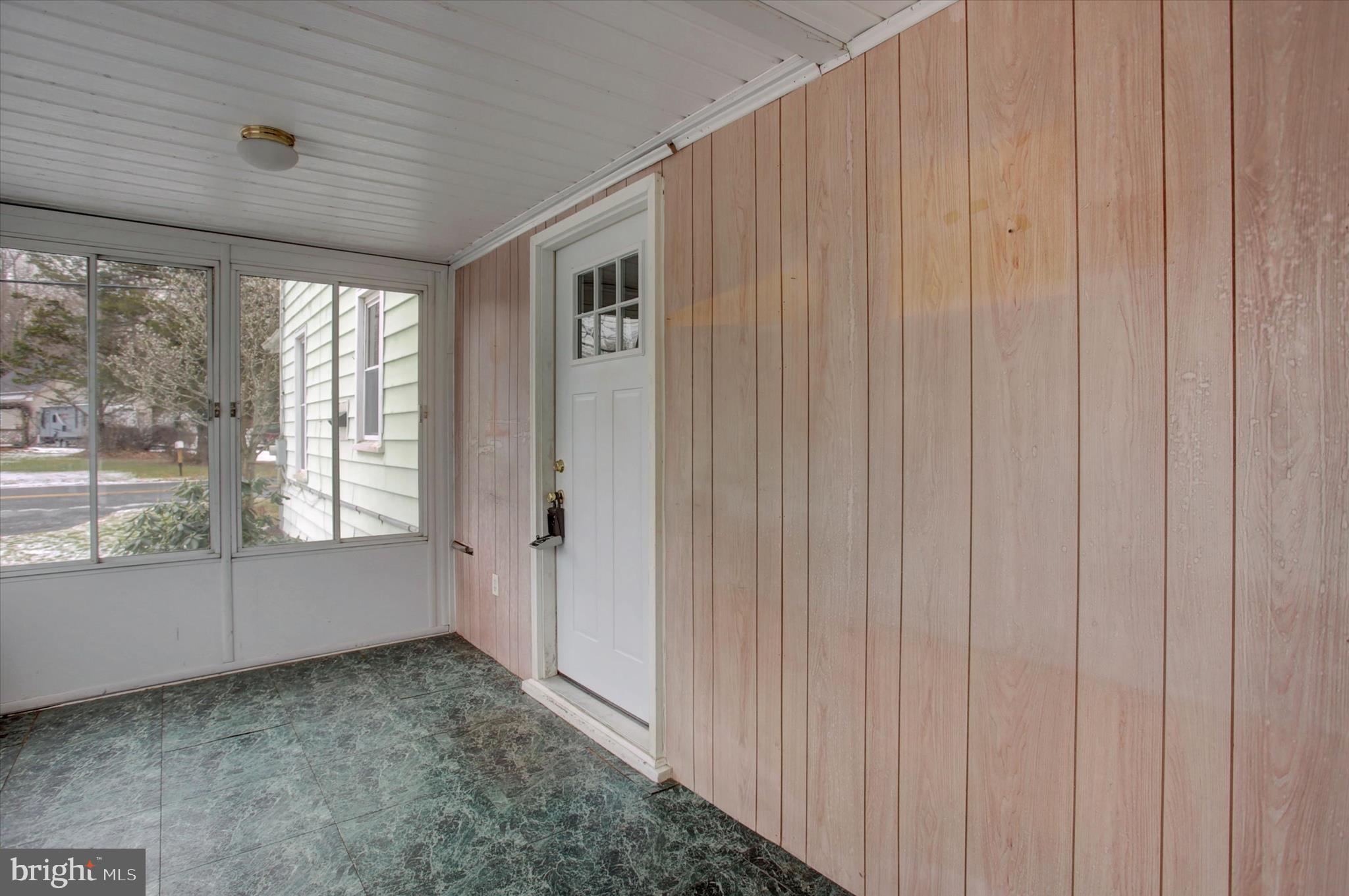 13515 Waterloo Road Waynesboro, PA 17268 - Photo 4 of 42 a view of an empty room with a fireplace and a window