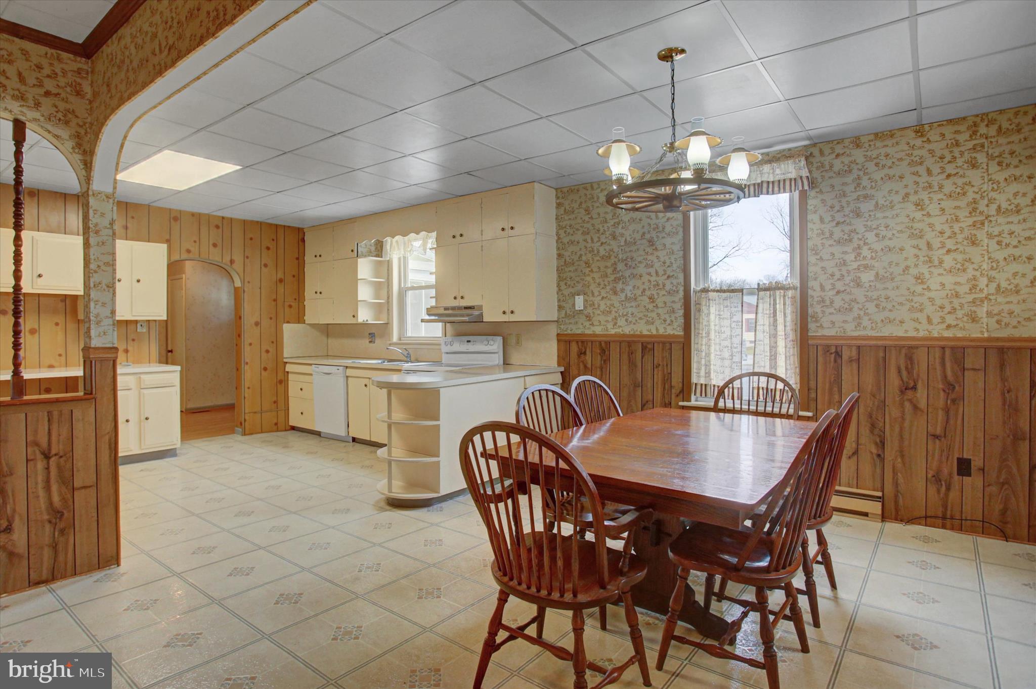 13515 Waterloo Road Waynesboro, PA 17268 - Photo 5 of 42 a dining room with furniture a chandelier and kitchen view