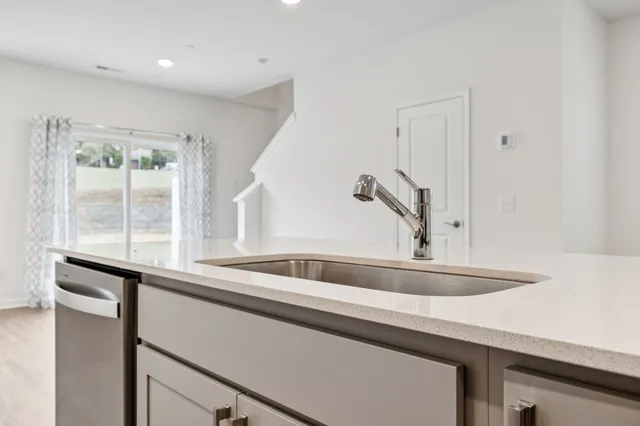 a kitchen with a sink and a window