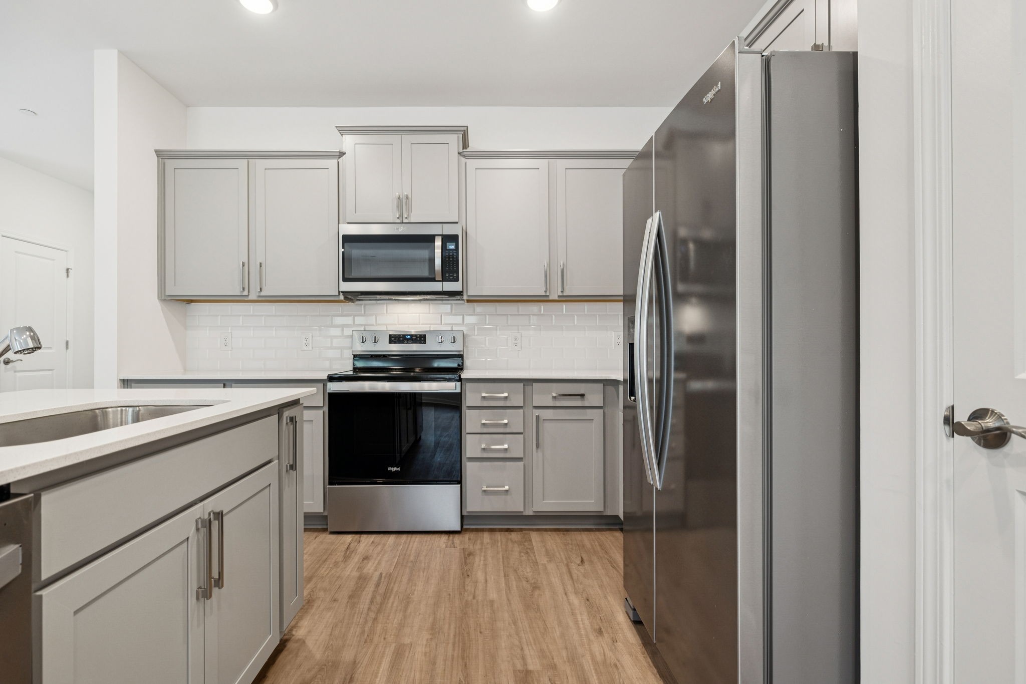 7148 Mapleside Lane Fairview, TN 37062 - Photo 14 of 39 a kitchen with a refrigerator stove and microwave