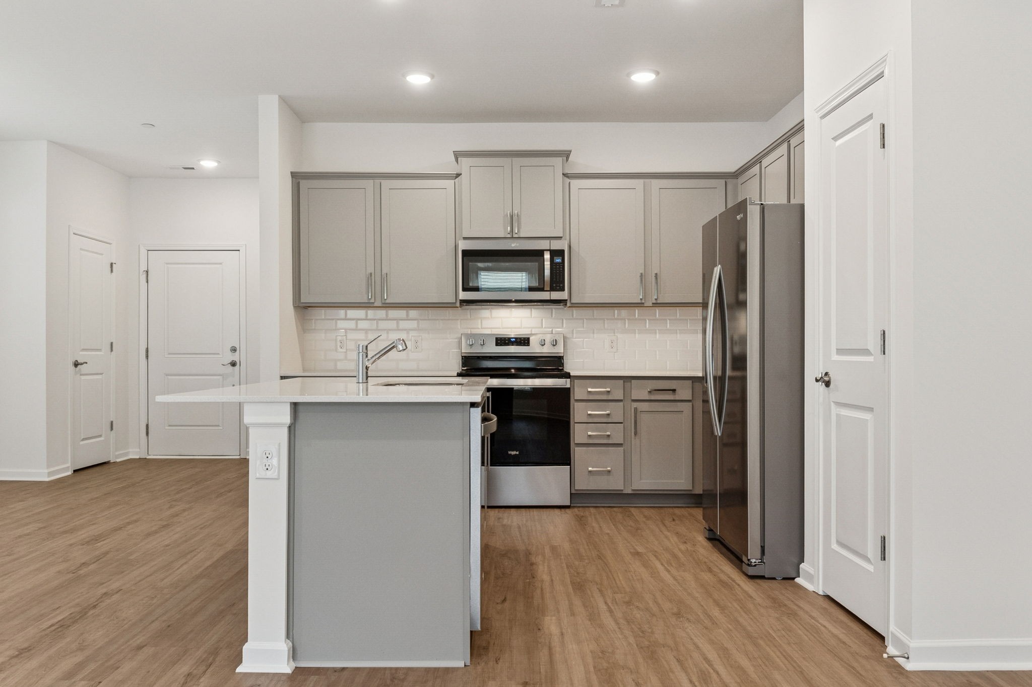 7148 Mapleside Lane Fairview, TN 37062 - Photo 15 of 39 a kitchen with a refrigerator and a stove top oven