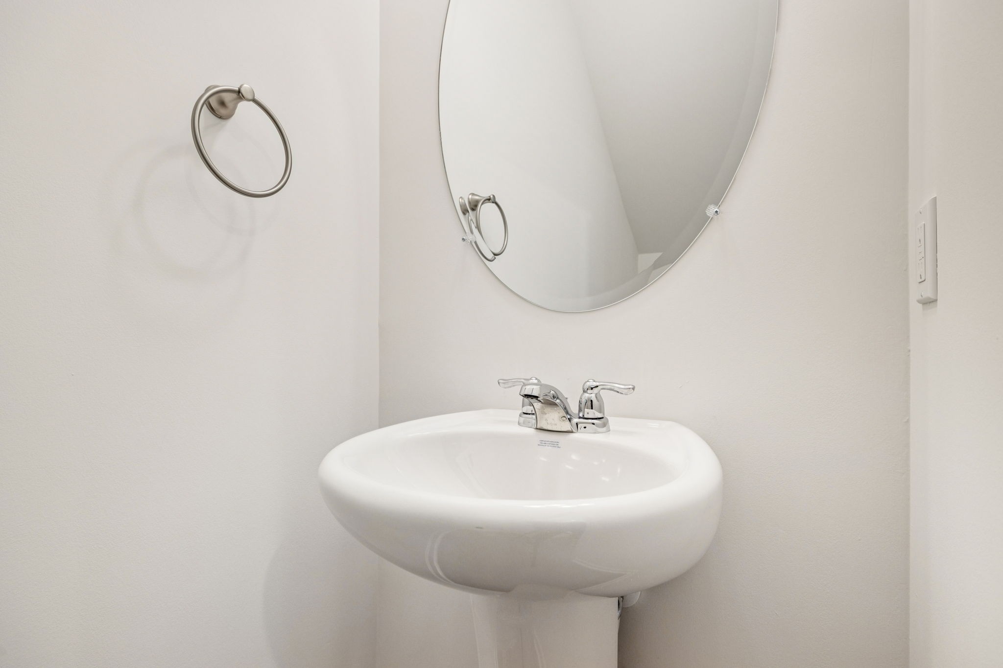 7148 Mapleside Lane Fairview, TN 37062 - Photo 19 of 39 a bathroom with a mirror and a sink