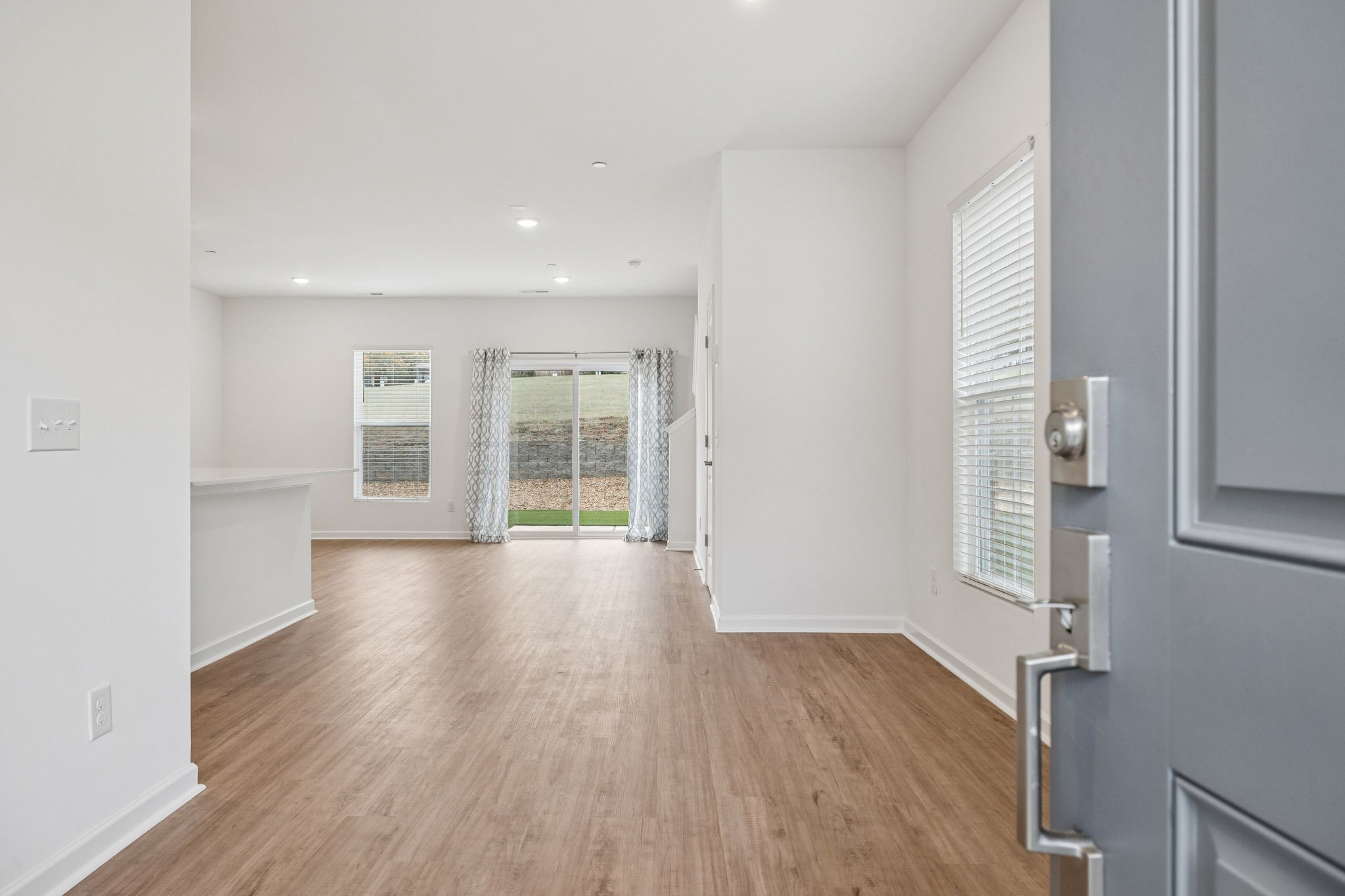 7148 Mapleside Lane Fairview, TN 37062 - Photo 4 of 39 wooden floor in an empty room with a window