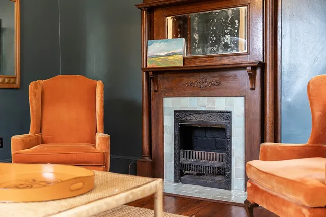 a living room with furniture and a fireplace