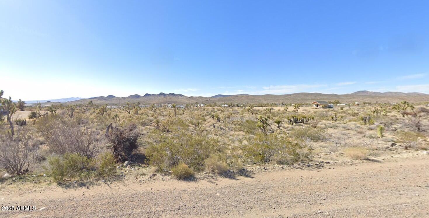 16773 Pierce Ferry Road, Unit 116 Dolan Springs, AZ 86441 - Photo 2 of 6 a view of a large mountain with mountains in the background